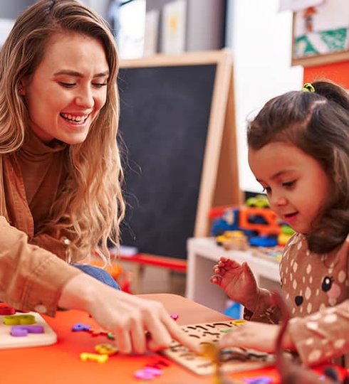 child and teacher doing an activity